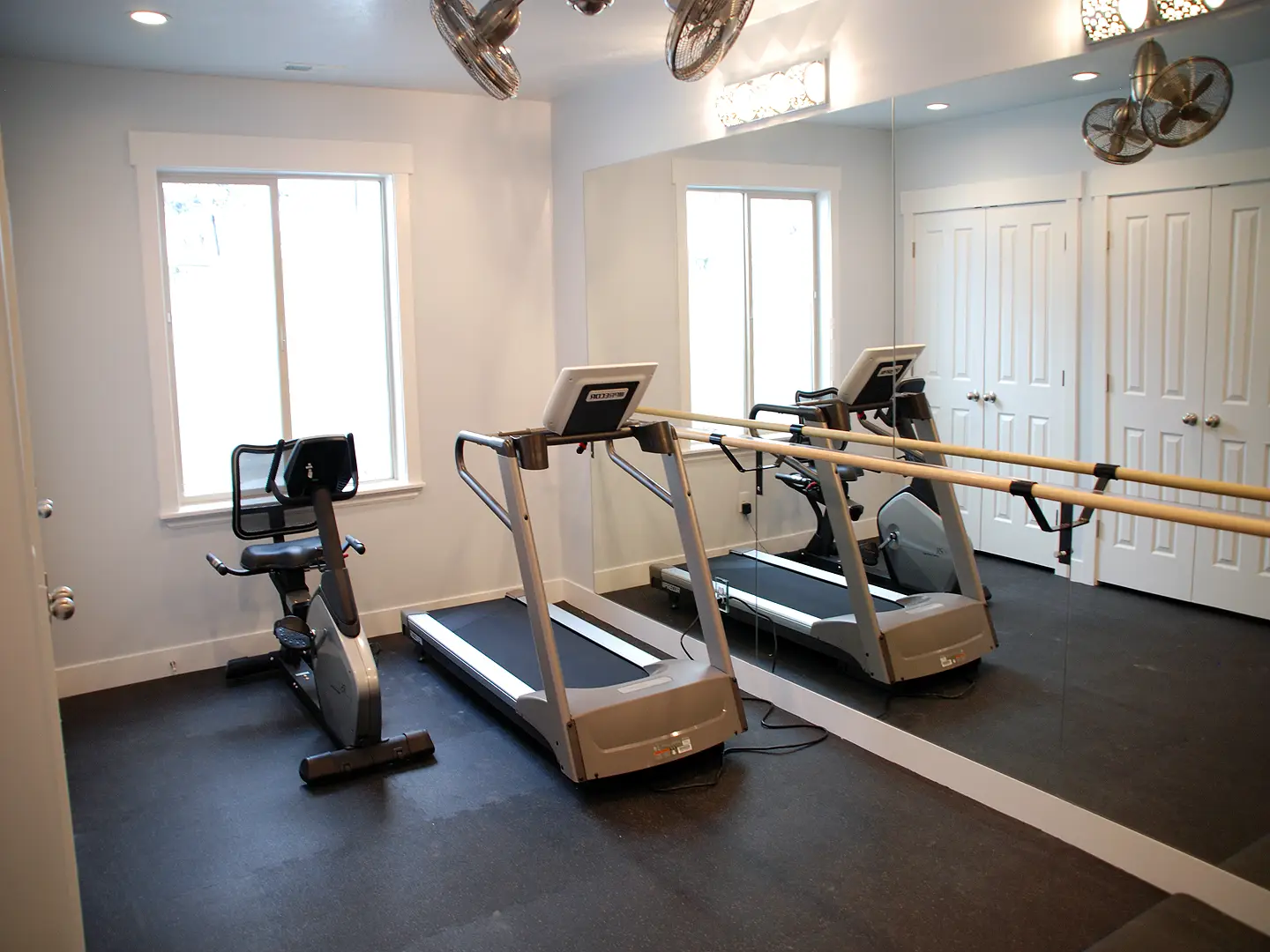 Utah Basement Finishing Home Gym with mirrors, treadmill and exercise bike