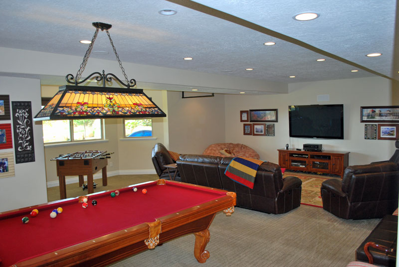 Utah Basement Finishing- family room with a pool table and large TV